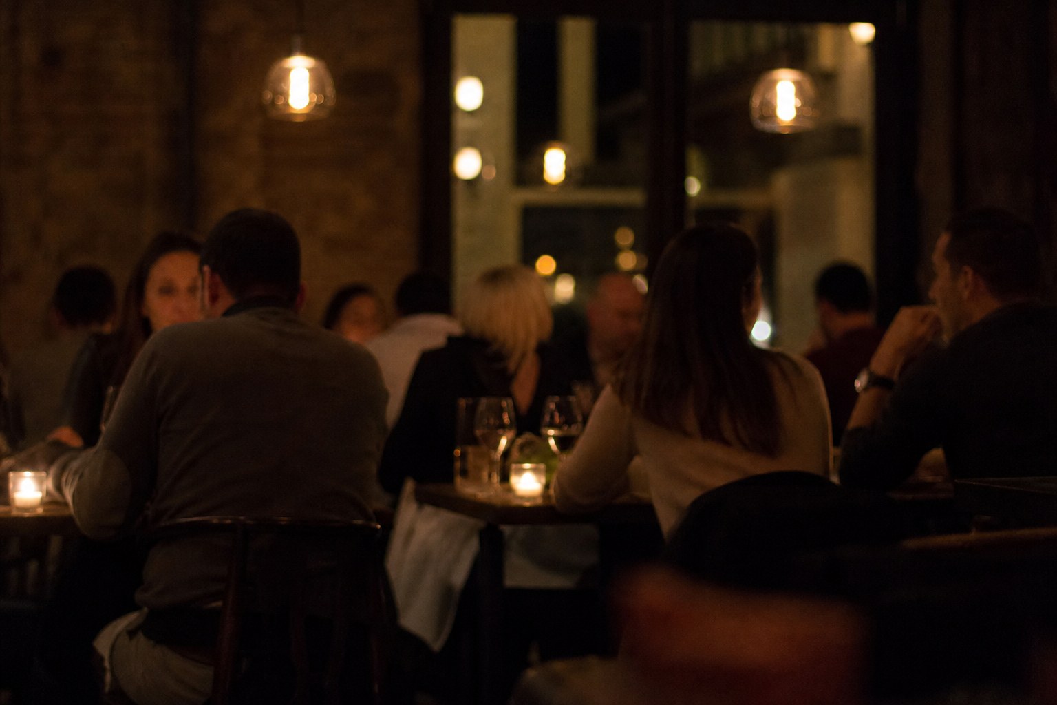 Guests at the tables after dark.