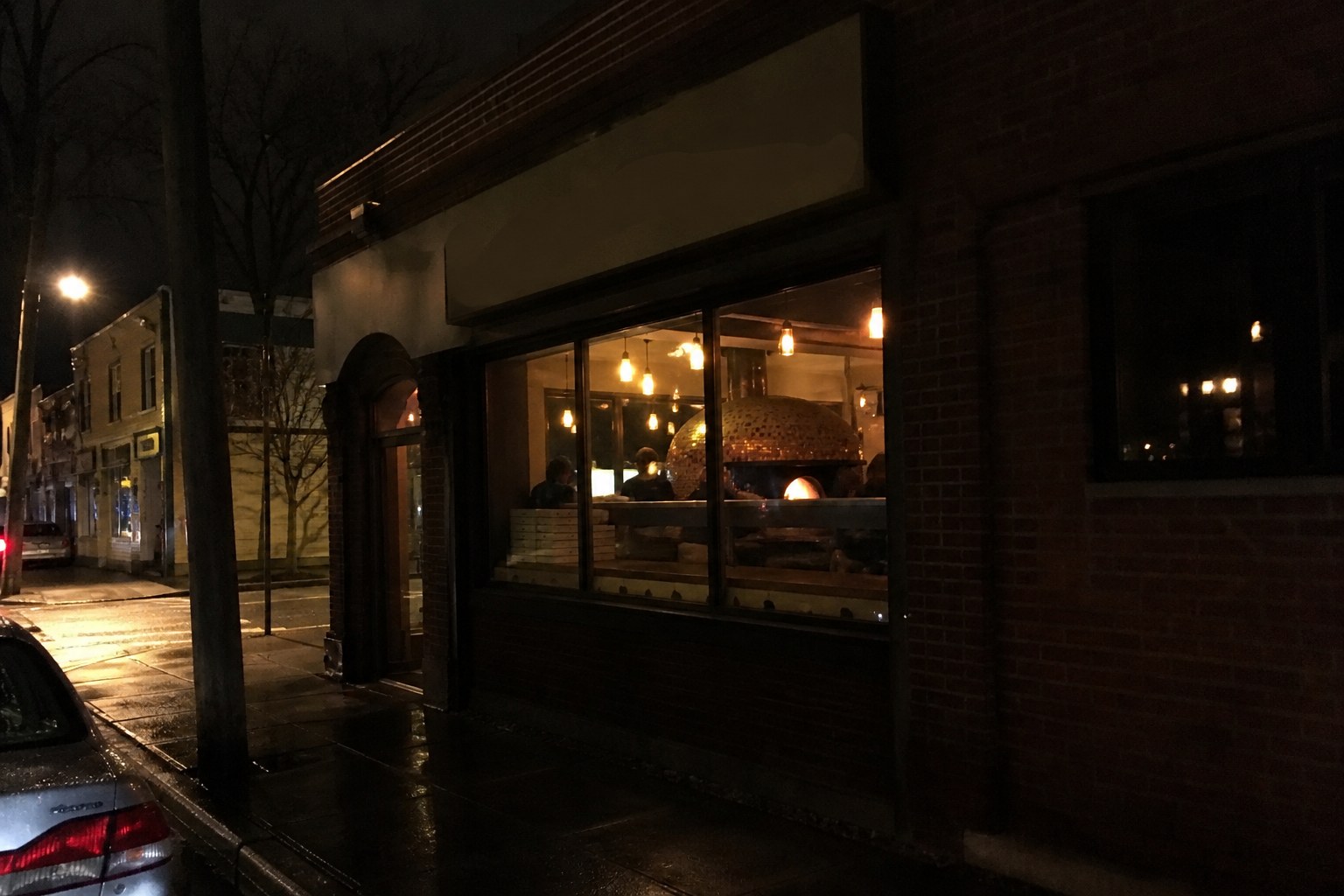 The storefront at night.